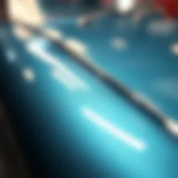 Close-up of metallic paint on a car surface showing reflections